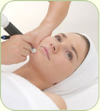 Microdermabrasion treatment on womans face